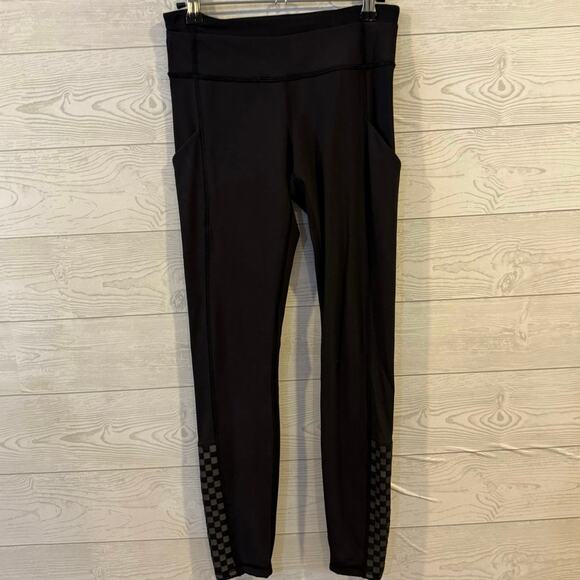 Lululemon Speed Tight III Size 4 black with reflective, checkerboard detail 
 - Picture 4 of 6